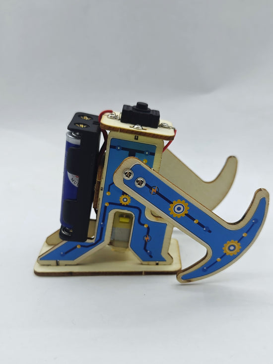 TippyBot robot close-up — crank shaft and wooden walking legs assembly