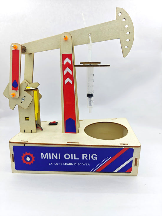Mini Oil Rig kit assembly — laser-cut wooden frame and motor components