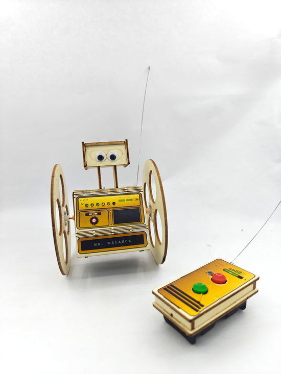 Mr. Balance robot build step — assembling wooden frame with screwdriver